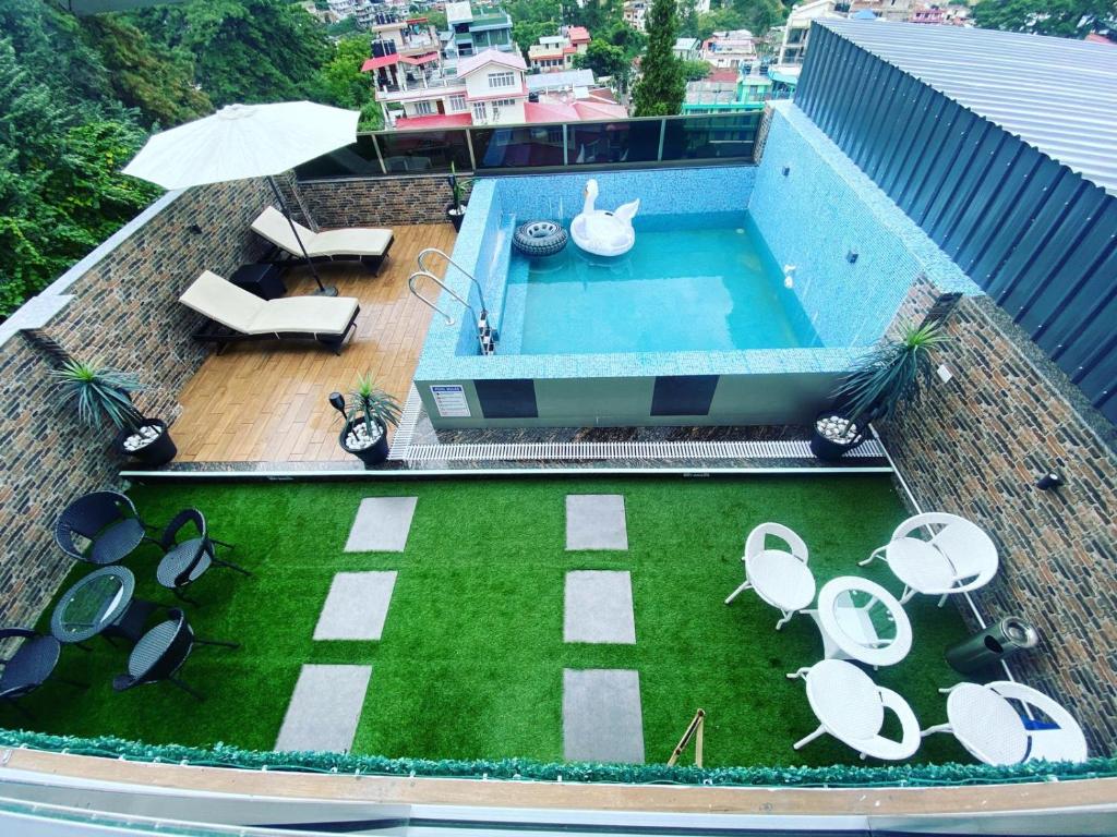 an overhead view of a swimming pool on top of a building at The Relyn Suite in Shillong