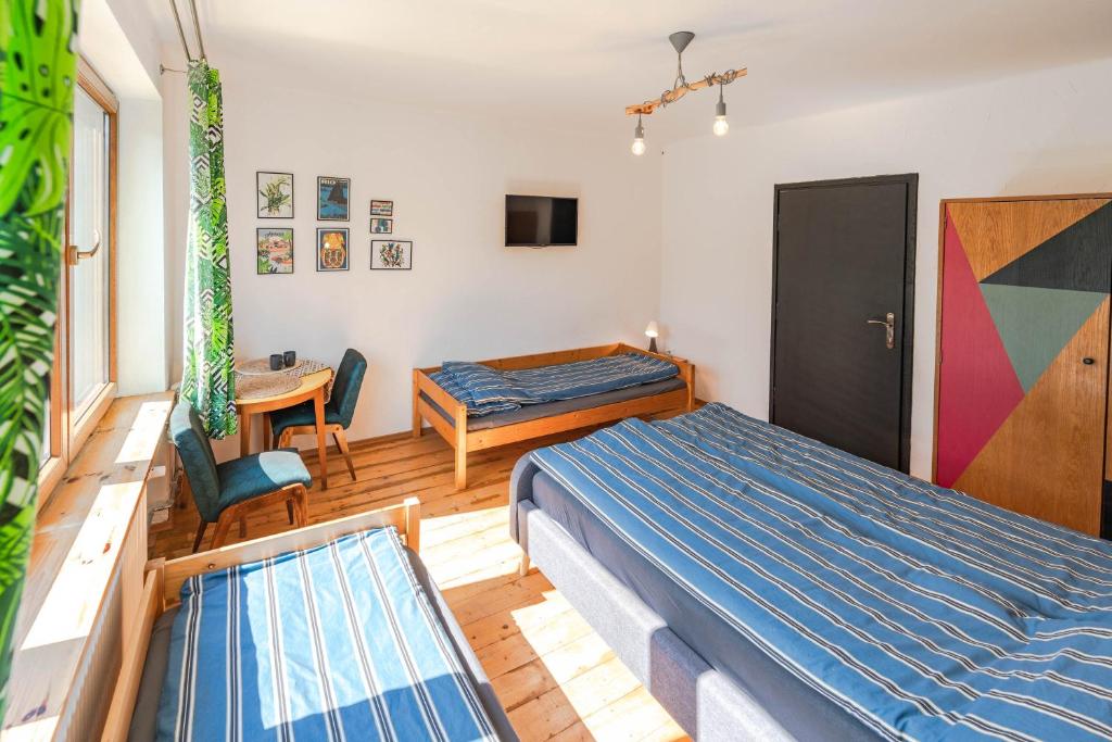 Postel nebo postele na pokoji v ubytování Apartament Latynoski z ogrodem - Dream Apart