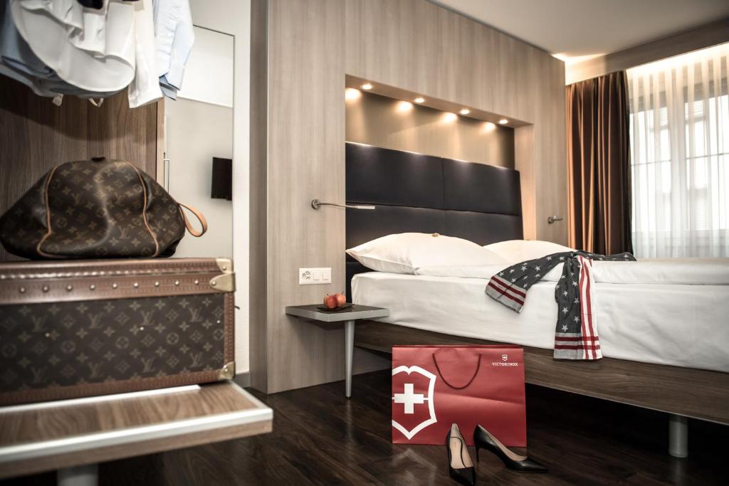 Ein Bett oder Betten in einem Zimmer der Unterkunft Hotel Alexander Zurich Old Town
