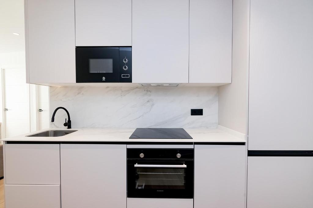 Kuchnia lub aneks kuchenny w obiekcie Amargura City Center Apartment