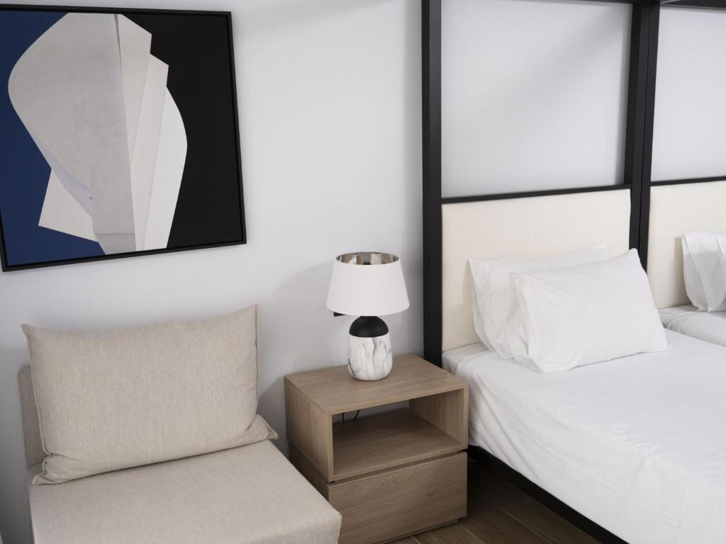 Postel nebo postele na pokoji v ubytování Hersonissos Palace