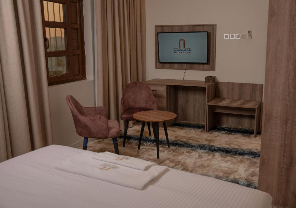 Postel nebo postele na pokoji v ubytování فندق المدينة القديمة Old Town Hotel
