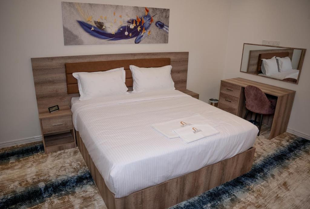 Postel nebo postele na pokoji v ubytování فندق المدينة القديمة Old Town Hotel
