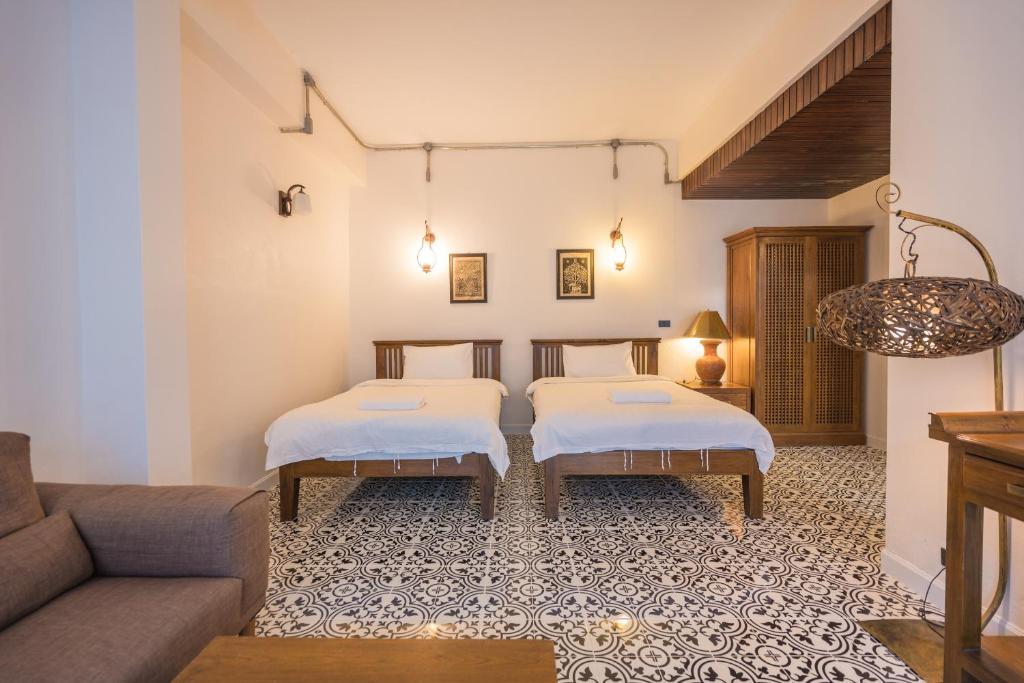 Postel nebo postele na pokoji v ubytování Yi's Garden Villa