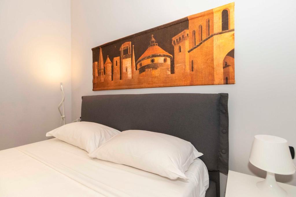 Voodi või voodid majutusasutuse Miglietti Apt a few steps from Piazza Statuto! toas
