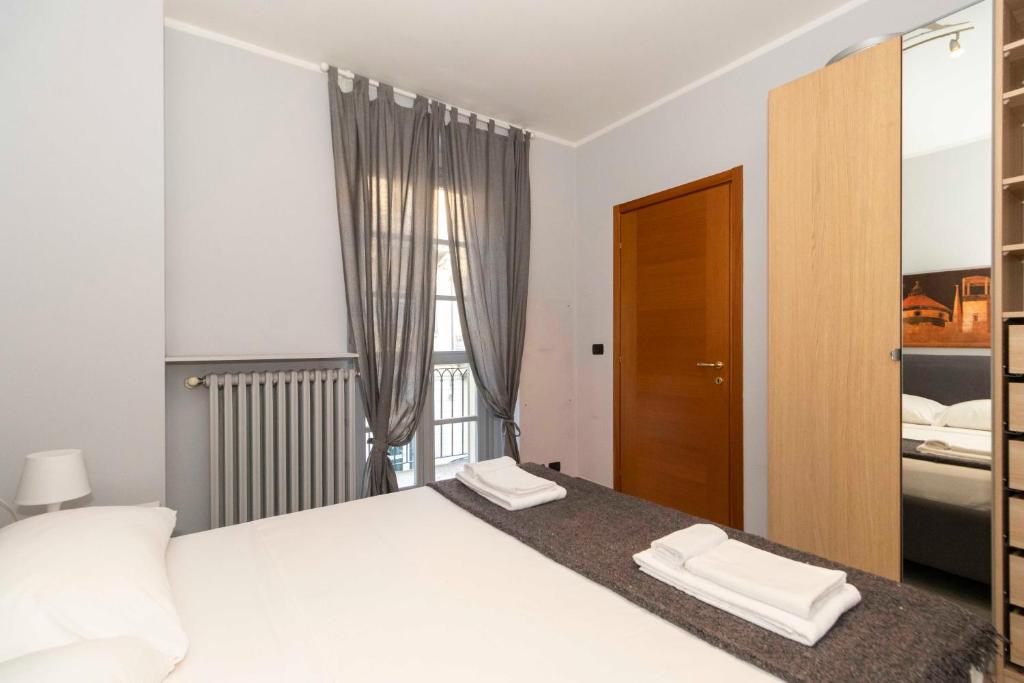 Voodi või voodid majutusasutuse Miglietti Apt a few steps from Piazza Statuto! toas