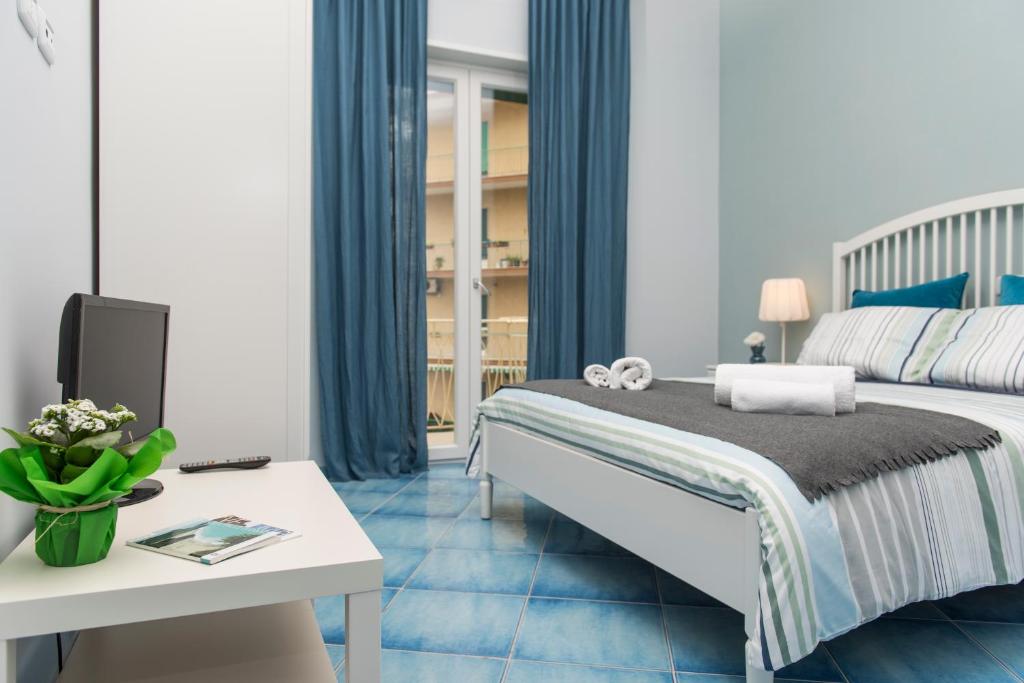 Posteľ alebo postele v izbe v ubytovaní CAPRI B&B