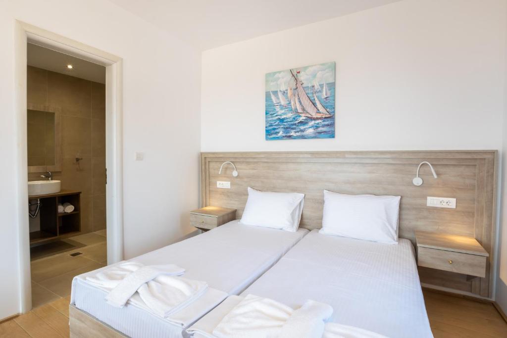 Posteľ alebo postele v izbe v ubytovaní Bella Karpathos Villas
