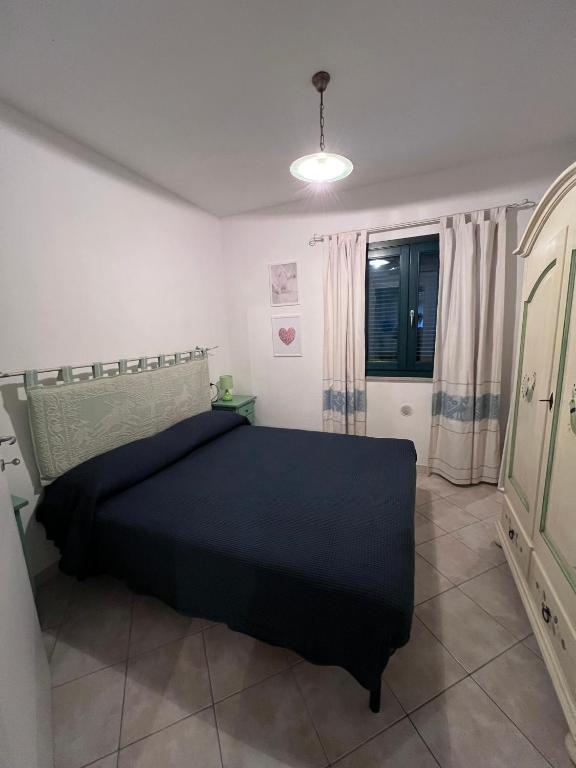 Łóżko lub łóżka w pokoju w obiekcie Appartamento 38 - Complesso Residenziale Terme di Casteldoria