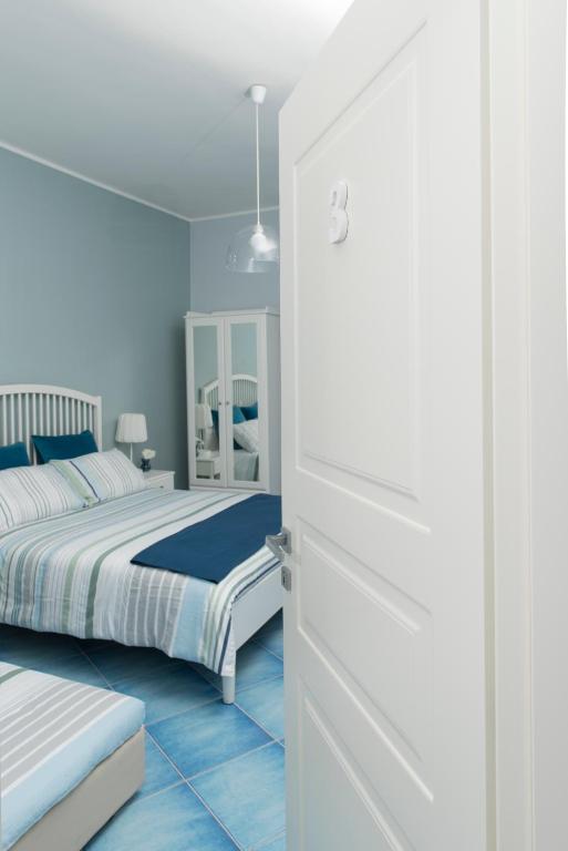 Posteľ alebo postele v izbe v ubytovaní CAPRI B&B