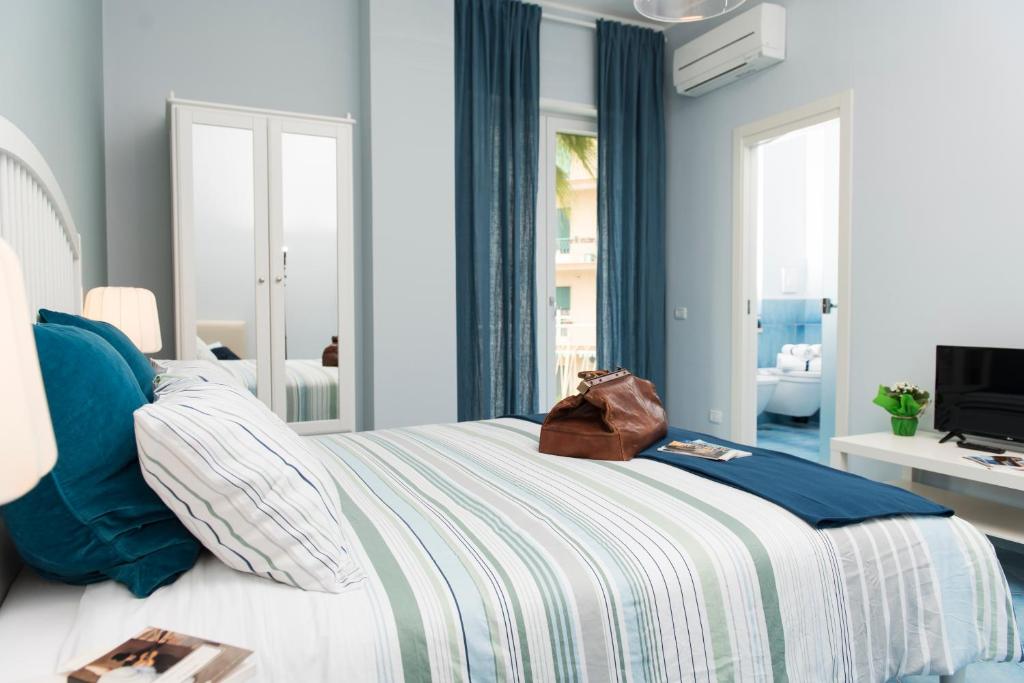 Posteľ alebo postele v izbe v ubytovaní CAPRI B&B