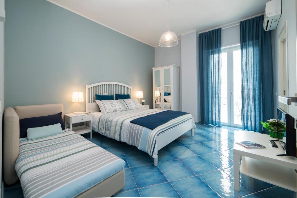 Posteľ alebo postele v izbe v ubytovaní CAPRI B&B