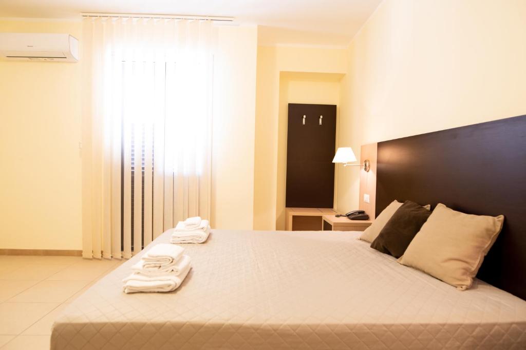 Postel nebo postele na pokoji v ubytování G&G Hotel