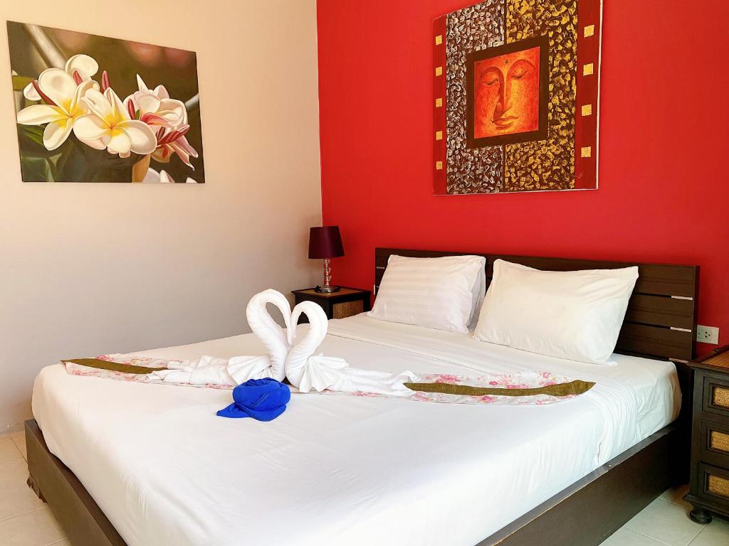 Postel nebo postele na pokoji v ubytování MA MAISON BOUTIQUE HOTEL. in PHUKET