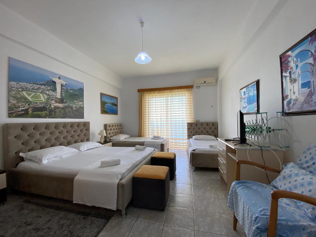 Postel nebo postele na pokoji v ubytování Hotel Odhisea Qeparo