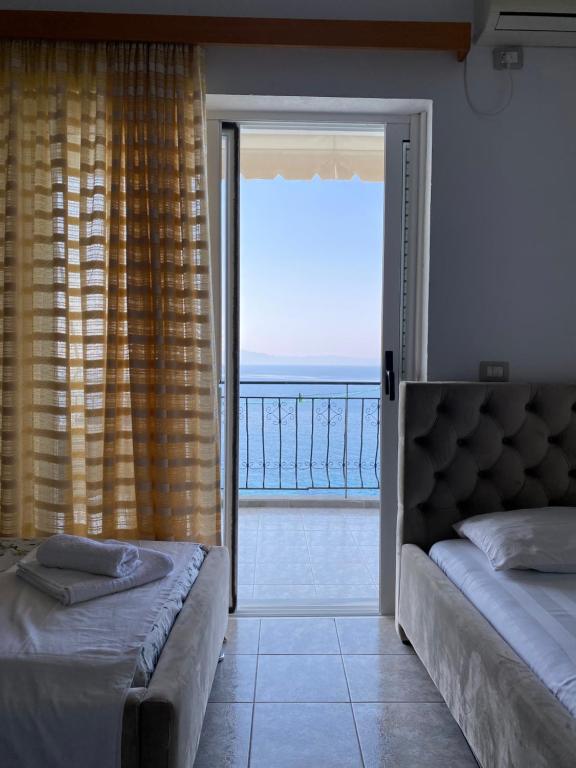 Postel nebo postele na pokoji v ubytování Hotel Odhisea Qeparo