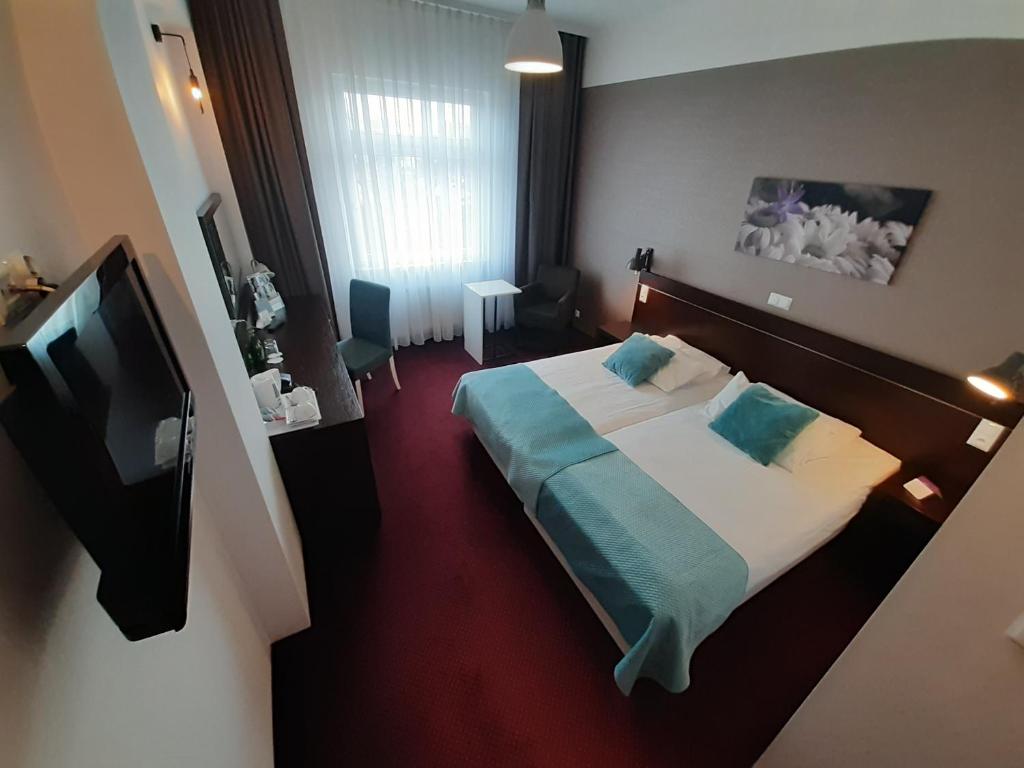 Posteľ alebo postele v izbe v ubytovaní Vestil Hotel