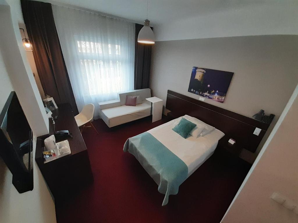 Posteľ alebo postele v izbe v ubytovaní Vestil Hotel