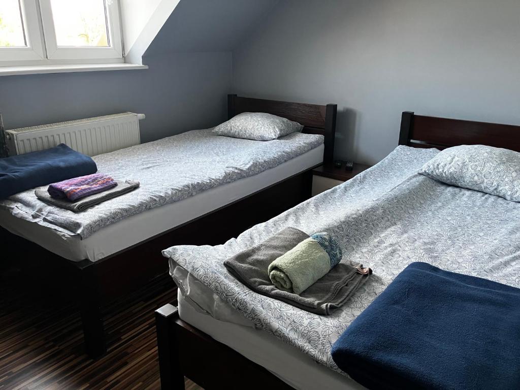 Postel nebo postele na pokoji v ubytování Wisełka