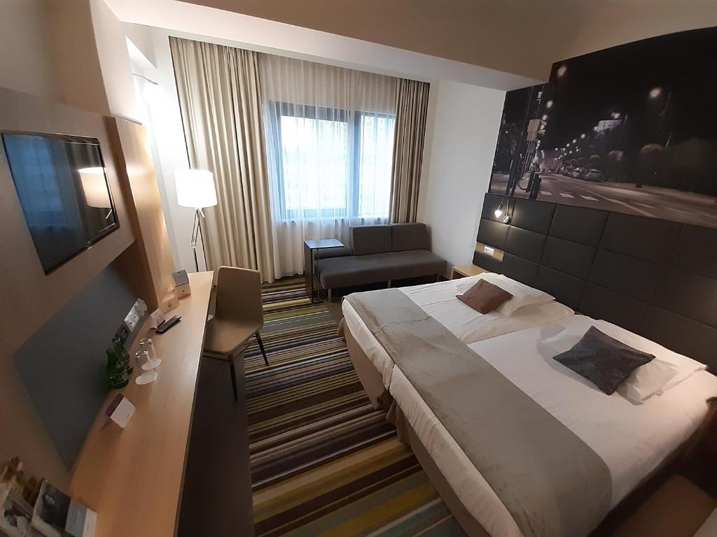 Posteľ alebo postele v izbe v ubytovaní Vestil Hotel