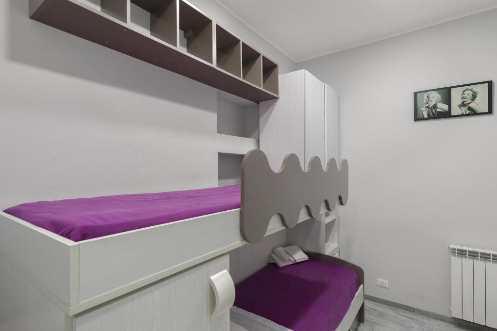 A bed or beds in a room at Casa bella