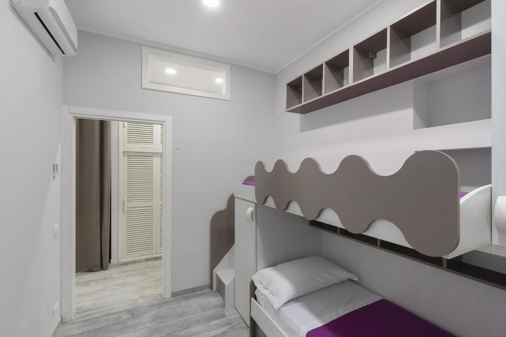 A bed or beds in a room at Casa bella