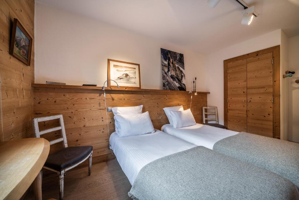 Łóżko lub łóżka w pokoju w obiekcie Apartment Valvisons Les Houches Chamonix - by EMERALD STAY