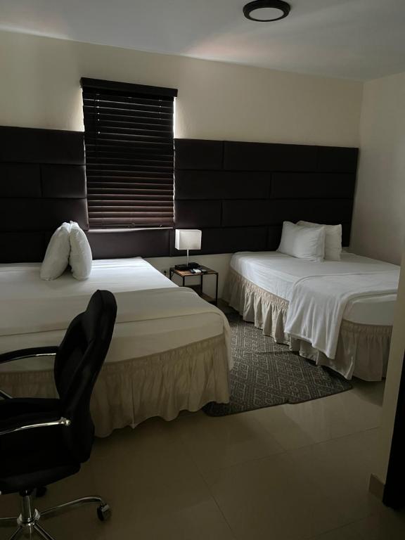 Postel nebo postele na pokoji v ubytování Starz hotel