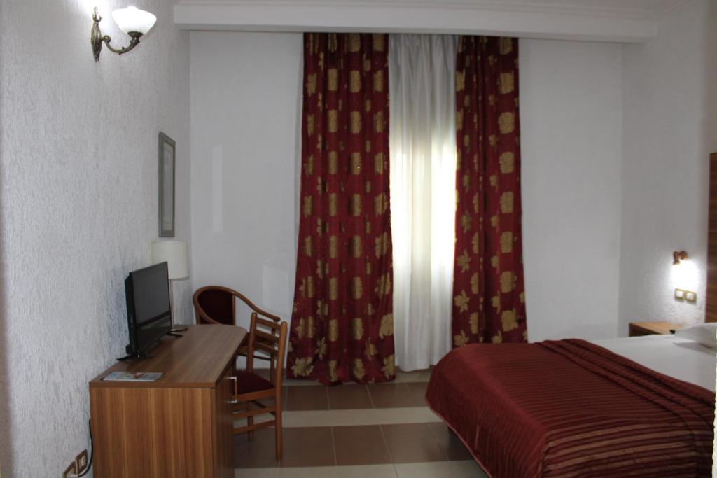 Postel nebo postele na pokoji v ubytování Hotel Franco Yaounde