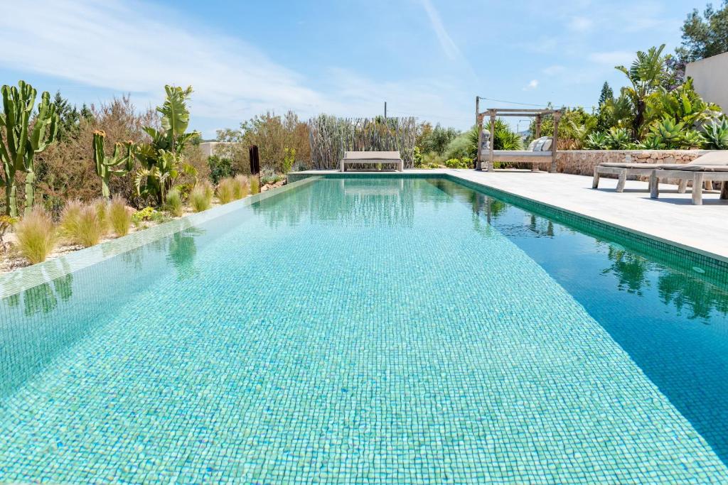 The swimming pool at or close to Lavish Ibizan Villa Beautiful Gardens Villa Izarra Private Pool Wonderful Country Views San Jose