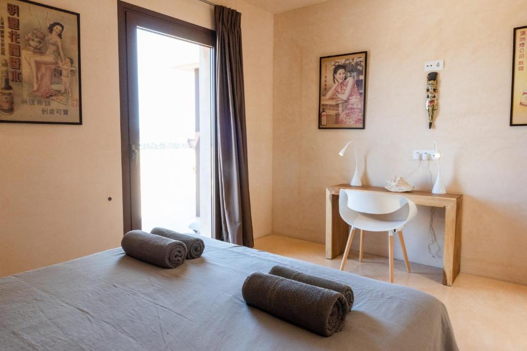 A bed or beds in a room at Lavish Ibizan Villa Beautiful Gardens Villa Izarra Private Pool Wonderful Country Views San Jose