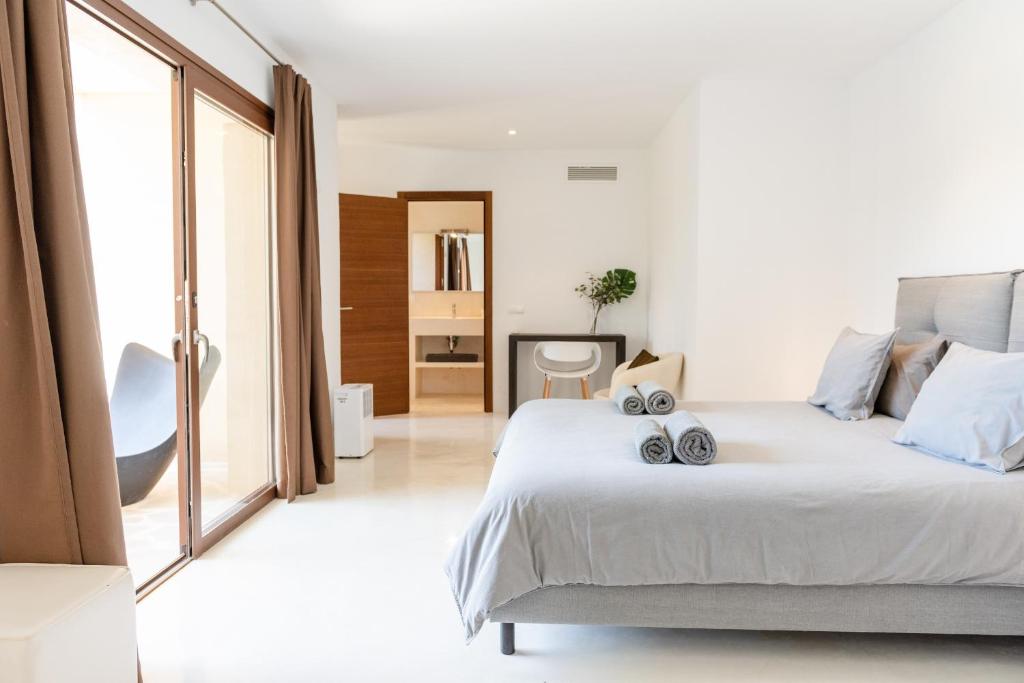 A bed or beds in a room at Lavish Ibizan Villa Beautiful Gardens Villa Izarra Private Pool Wonderful Country Views San Jose