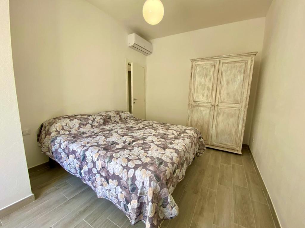 A bed or beds in a room at Appartamento Etruria
