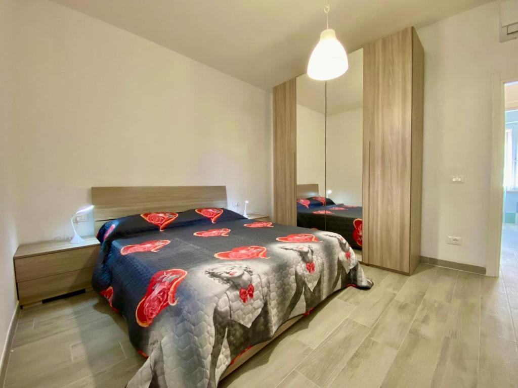 A bed or beds in a room at Appartamento Etruria