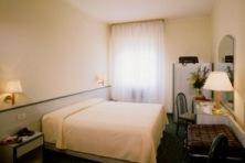 Postel nebo postele na pokoji v ubytování Hotel Columbia Terme