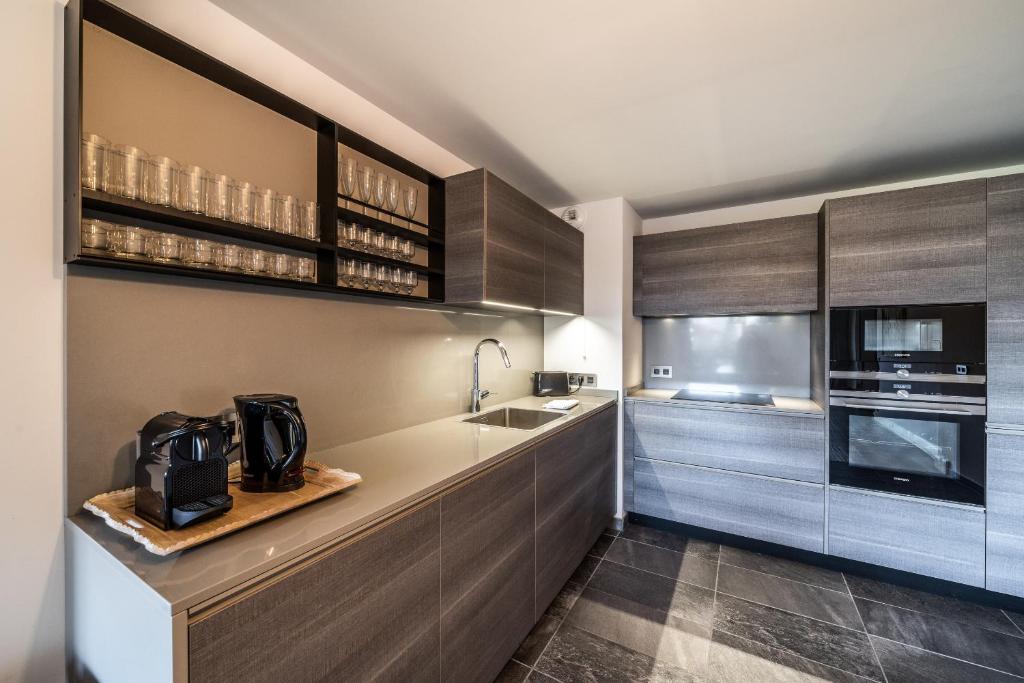 Kuchyňa alebo kuchynka v ubytovaní Apartment Cortirion Megeve - by EMERALD STAY
