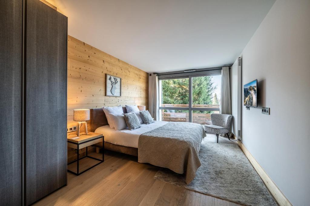 Posteľ alebo postele v izbe v ubytovaní Apartment Cortirion Megeve - by EMERALD STAY