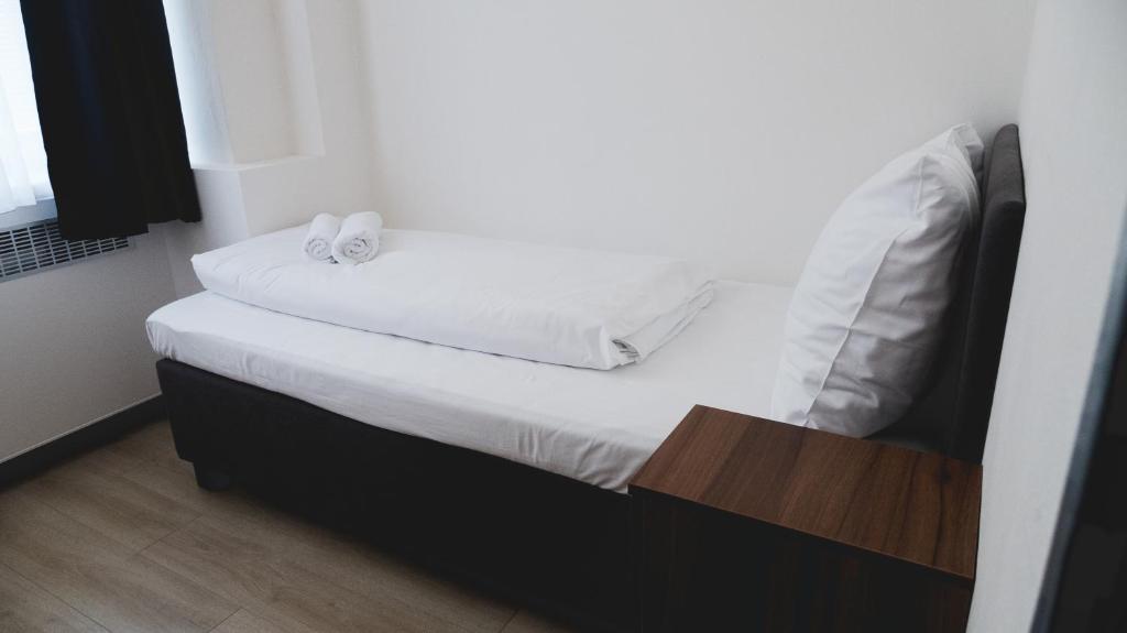 Postel nebo postele na pokoji v ubytování Hotel U Ševce