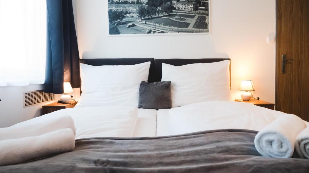 Postel nebo postele na pokoji v ubytování Hotel U Ševce