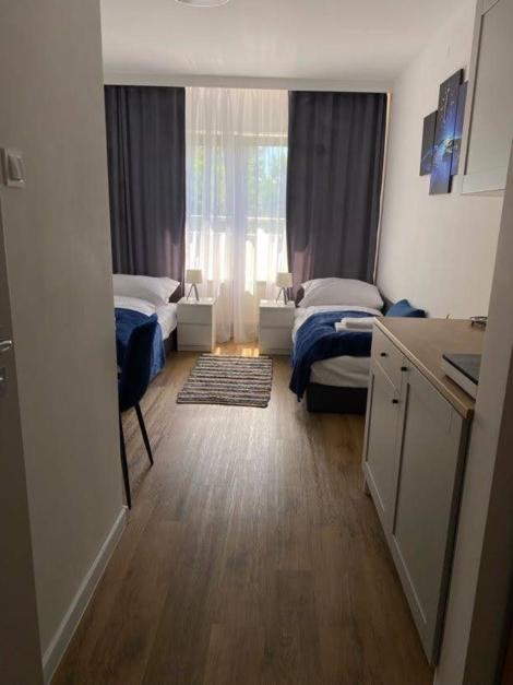 Posteľ alebo postele v izbe v ubytovaní Apartamenty nad zalewem 222