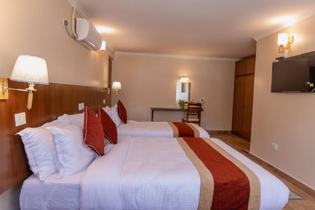 Hotel Fewa Camp客房内的一张或多张床位