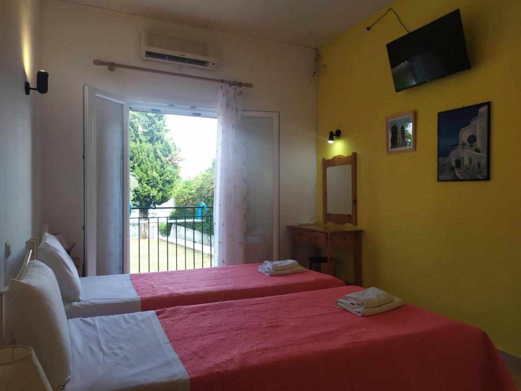 Postel nebo postele na pokoji v ubytování Eva Apartments