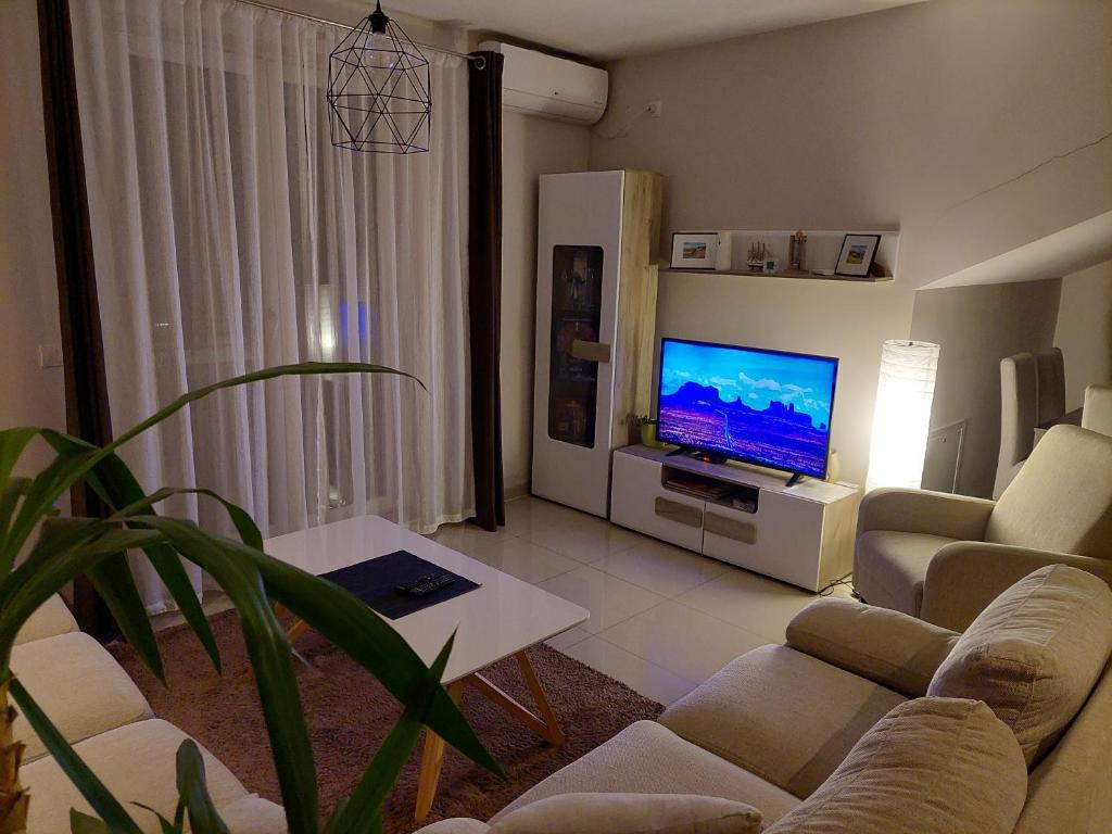 TV a/nebo společenská místnost v ubytování A2