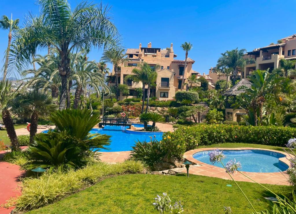 a view of the resort from the garden at Apartment next to the El Campanario, Atalaya Golf in Estepona