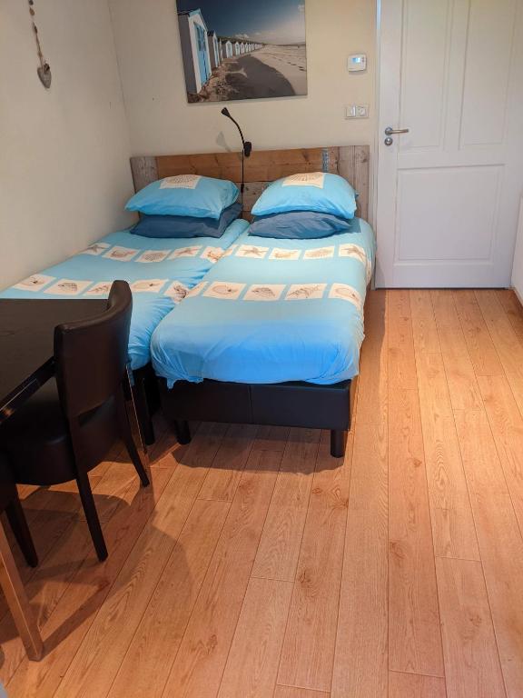 Postel nebo postele na pokoji v ubytování Logies21 Texel