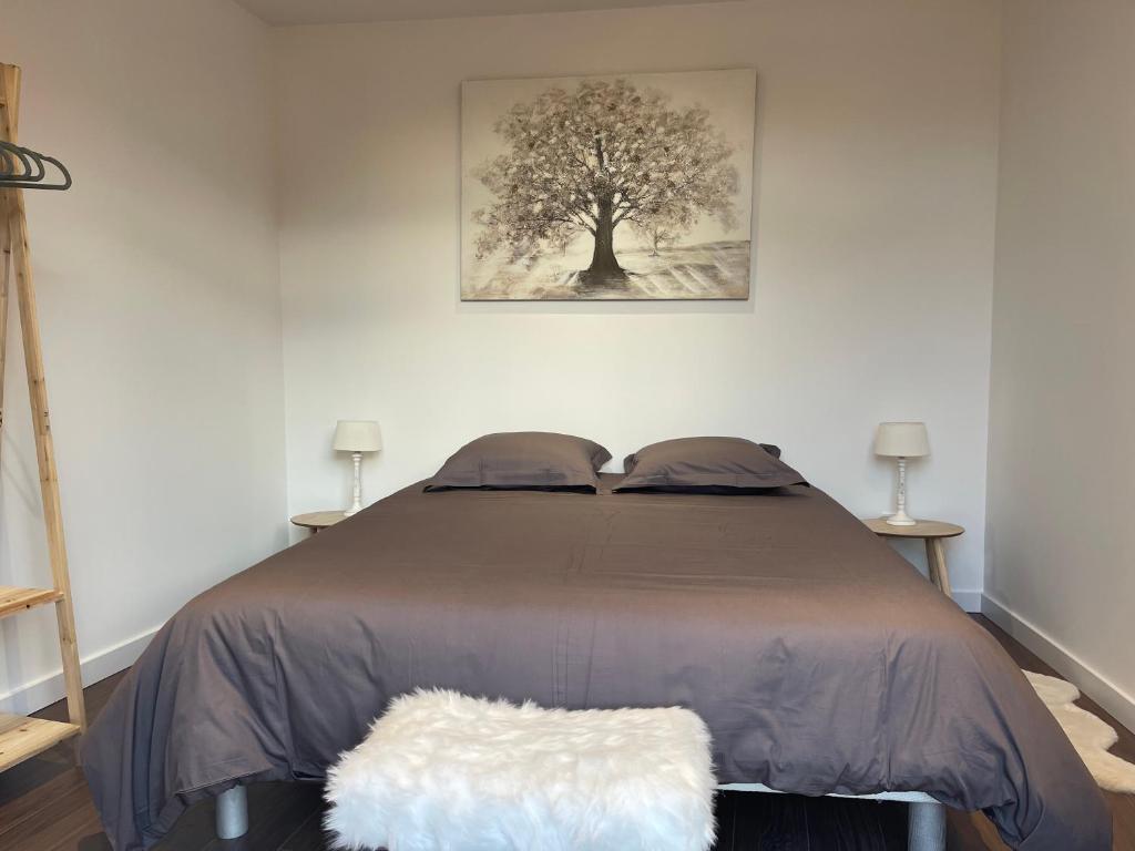 Postel nebo postele na pokoji v ubytování Les Appartements du Cep’t