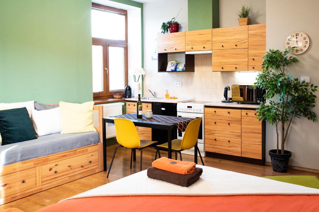 a small kitchen with a table and chairs in a room at Apartmán u Horynů - Sadová in Česká Třebová