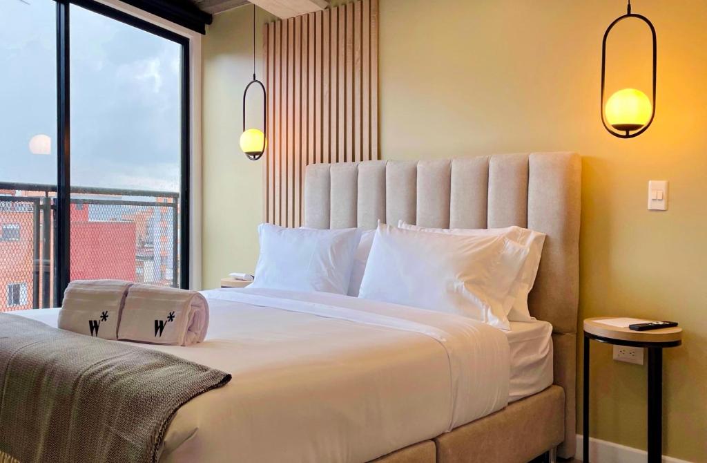 מיטה או מיטות בחדר ב-Elegant 1BR in Chapinero