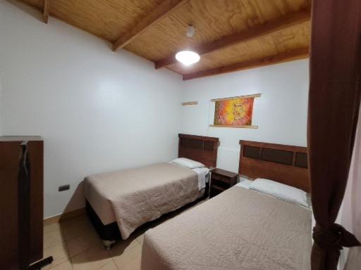 Uma cama ou camas num quarto em Lalck Cketi Hospedaje y Turismo