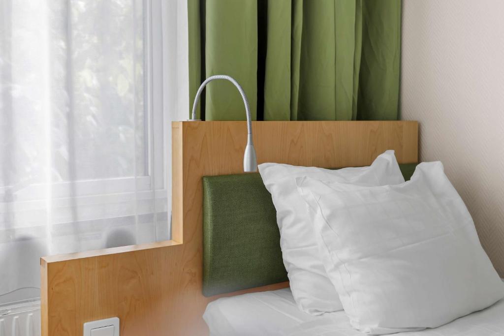 Postel nebo postele na pokoji v ubytování Best Western Hotel Royal